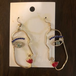 Gold face earrings - street style